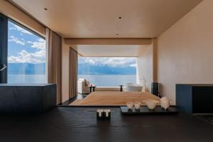 Ένα ή περισσότερα κρεβάτια σε δωμάτιο στο Dali Rushi Jiuxi Sea View Holiday Inn