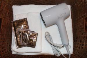 a wii game controller sitting on a white towel at 信州の古民家宿 真秀ろばmahoroba in Nagano