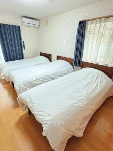 Voodi või voodid majutusasutuse Tazuno-Nakano toas