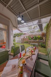 a patio with a table with food on it at BB House Villa in Da Thanh