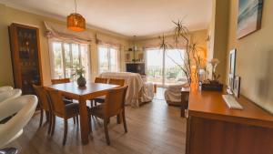 a living room with a table and a dining room at SeaHomes Vacations - NAUTIC MARITIME Apt in Blanes
