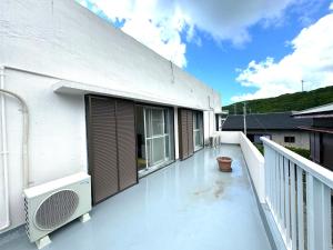 Balkón nebo terasa v ubytování 徳之島体験お宿結屋