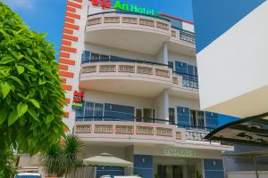 an apartment building with a balcony and a hotel at Đại An Hotel Bến Tre in Ben Tre