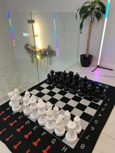 a chess board on a checkerboard at Apartamenty Katowice by Lantier - Swimming Pool Zone in Bytom
