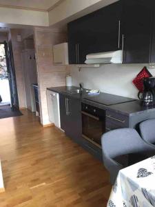 a kitchen with a sink and a counter top at Pleasant mountain apartment in Røldal, with a view in Håra
