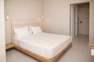 Ένα ή περισσότερα κρεβάτια σε δωμάτιο στο Elia Suites +52 φωτογραφίες