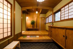 a hallway of a building with shoes on the floor at 康郷 箱根湯本 in Wada