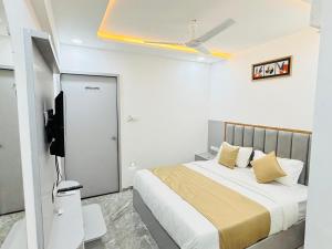 Postel nebo postele na pokoji v ubytování hotel sun pride