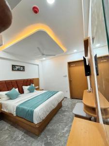 Postel nebo postele na pokoji v ubytování hotel sun pride