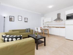 a living room with a couch and a table at My little paradise in Cotillo