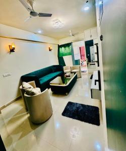 a living room with a couch and a table at Khokhar studio in Karnal