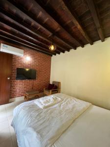 Ένα ή περισσότερα κρεβάτια σε δωμάτιο στο Lalitpur Stay