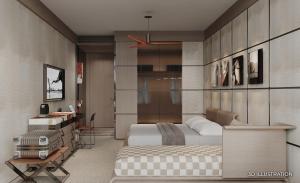 a bedroom with two beds and a desk in it at Voyage Kundu in Antalya