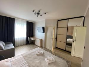 a hotel room with a bed and a mirror at Приватна садиба Європа in Solochyn +82 photos
