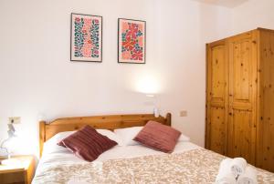 Ένα ή περισσότερα κρεβάτια σε δωμάτιο στο Lòbia Parrocchiale