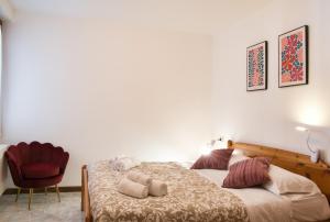 Ένα ή περισσότερα κρεβάτια σε δωμάτιο στο Lòbia Parrocchiale +63 φωτογραφίες