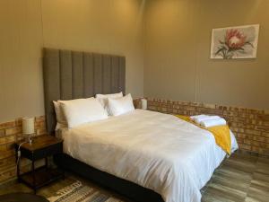 Ένα ή περισσότερα κρεβάτια σε δωμάτιο στο EastClaire Guesthouse +16 φωτογραφίες