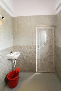 a bathroom with a sink and a shower at Rk Resorts in Bangalore +8 photos