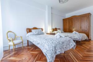 Postel nebo postele na pokoji v ubytování casa cervantes