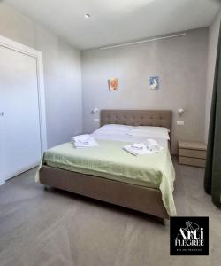 Ένα ή περισσότερα κρεβάτια σε δωμάτιο στο Arti Flegree