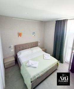 Ένα ή περισσότερα κρεβάτια σε δωμάτιο στο Arti Flegree +2 φωτογραφίες