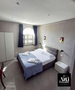 Ένα ή περισσότερα κρεβάτια σε δωμάτιο στο Arti Flegree