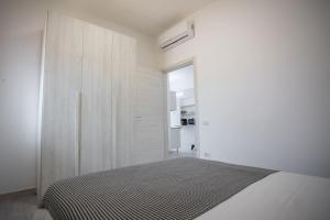 Ένα ή περισσότερα κρεβάτια σε δωμάτιο στο Villa LUCE DEL SUD Punta Prosciutto