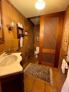 a bathroom with a sink and a toilet at Spacious Villa with Pool in Cabeanca 250 m² in Ourense