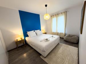 Ένα ή περισσότερα κρεβάτια σε δωμάτιο στο Gite Matisse