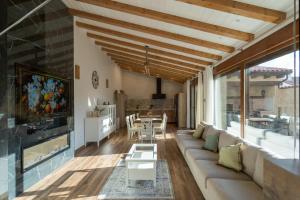a living room with a couch and a fireplace at Casa Teresa in La Santa Espina