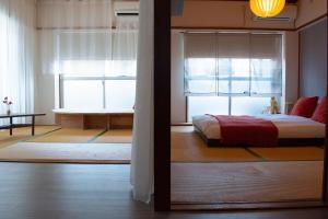 Ένα ή περισσότερα κρεβάτια σε δωμάτιο στο Howa Apt 303