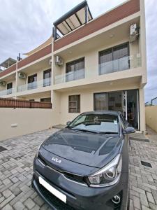 a car parked in front of a house at So Chic Family Villa in Flic-en-Flac +17 photos