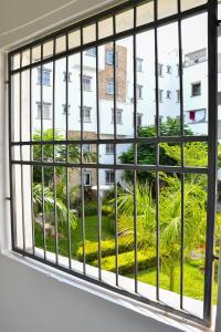 a window with a view of a building at Buxton Point Mombasa in Mombasa