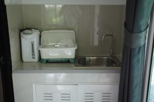 a kitchen counter with a sink and a mixer at Palm tree garden house NinemintoAonangbeach in Ao Nam Mao