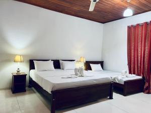 Ένα ή περισσότερα κρεβάτια σε δωμάτιο στο Cactus Beach - Tangalle