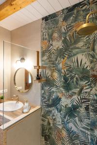 a bathroom with a sink and a mirror at Casa Teresa in La Santa Espina