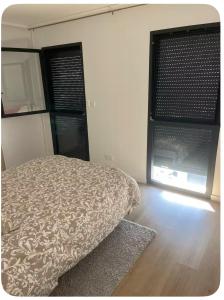 Ένα ή περισσότερα κρεβάτια σε δωμάτιο στο Chez Jorge