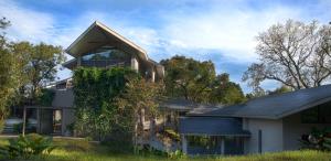 a house with a pitched roof at Stanley Revelation in Attigundi