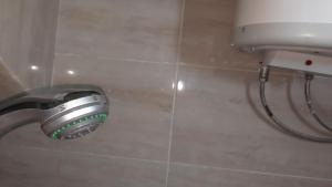 a shower head in a bathroom with a toilet at استراحة الباشا albash farm stay in Al Karāmah +63 photos