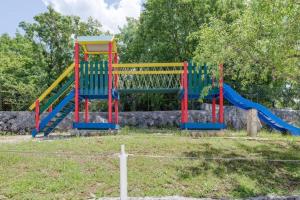 a group of playground equipment in a park at Family friendly house with a swimming pool Kotlenice, Zagora - 22219 in Dugopolje