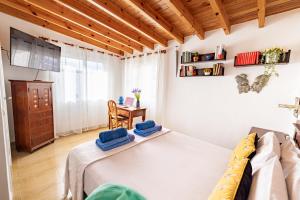 a bedroom with a bed with blue towels on it at Villa La Maja Beachfront in Corralejo +39 photos