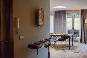 a room with a table with pots and pans at Kel Domènech Luxury Apartment in Besalú