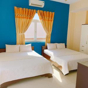 Ένα ή περισσότερα κρεβάτια σε δωμάτιο στο Tan Duy Hotel