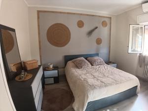 a bedroom with a bed and a wall with planets at Cuoredicasamia in Isola del Liri