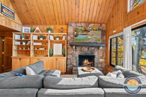 a living room with a couch and a fireplace at 405 Waldeck Dr in Twin Lakes