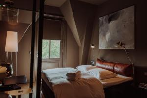 Ένα ή περισσότερα κρεβάτια σε δωμάτιο στο Boutique Hotel Blue - Quality Lodgings +16 φωτογραφίες