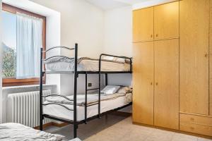 Ένα ή περισσότερα κρεβάτια σε δωμάτιο στο Appartamenti l'Edera