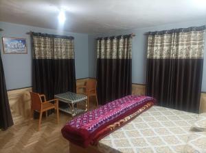 Voodi või voodid majutusasutuse Snow Peaks View Homestay toas +10 fotot