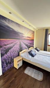 a bedroom with a mural of a lavender field at Willa Sulejowka in Poronin