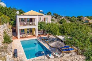 an aerial view of a villa with a swimming pool at Villa Apollon by Villa Plus in Spathíon